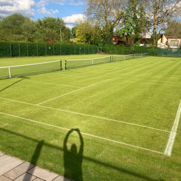 Pristine lawn tennis court surface