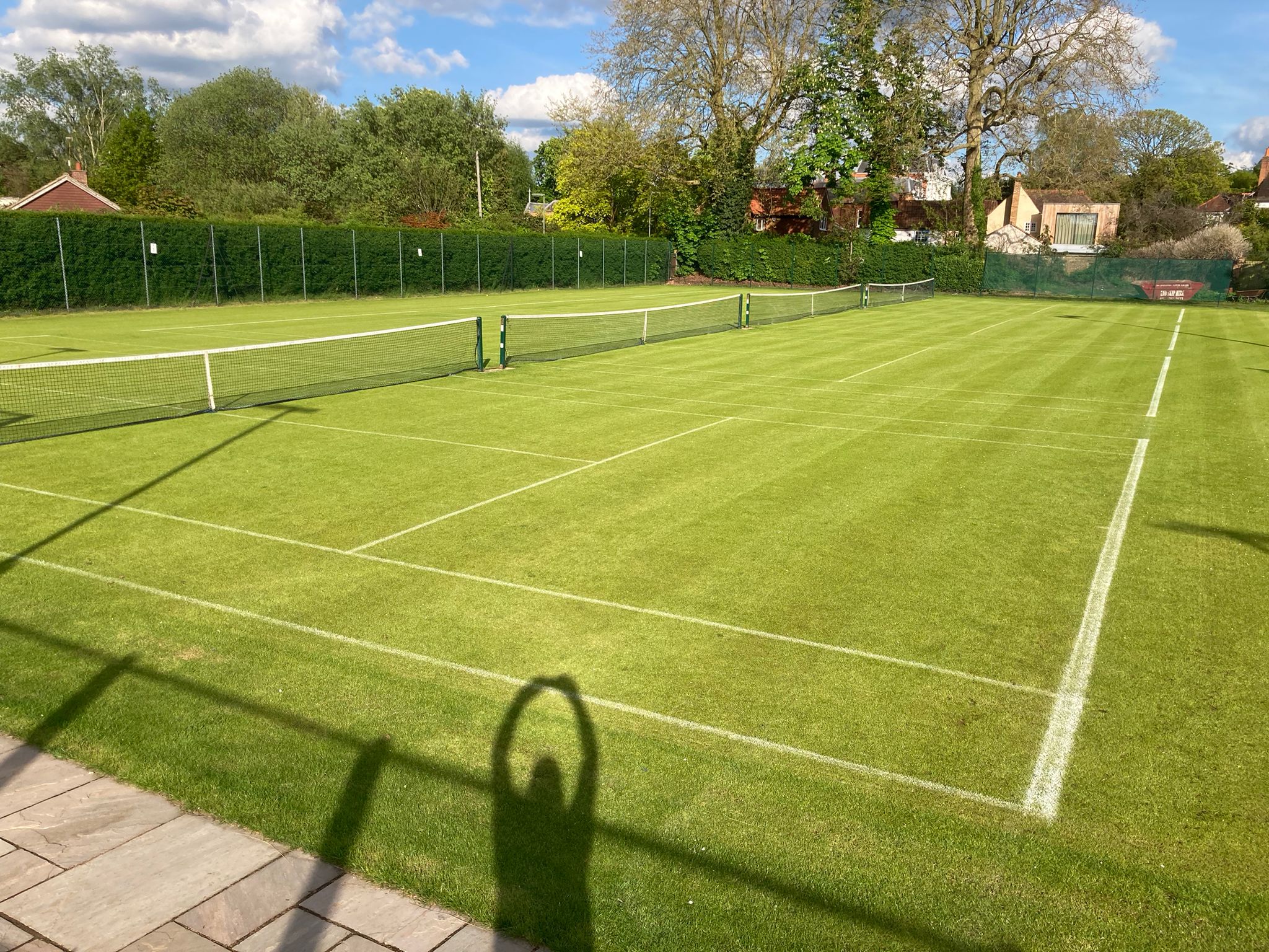 Pristine lawn tennis court surface